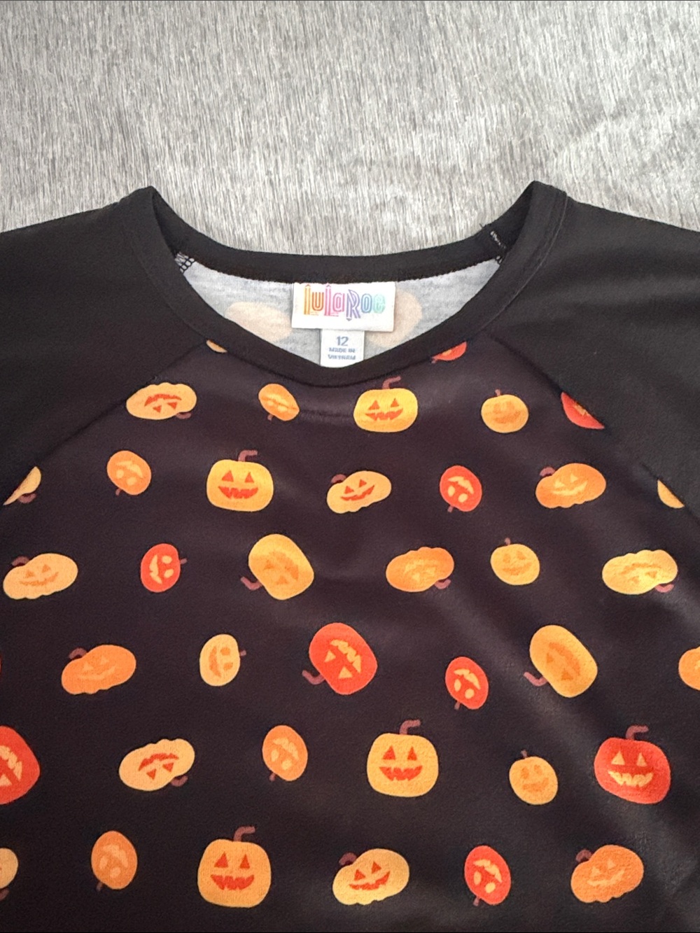 LuLaRoe Black Top with Orange & Yellow Pumpkin Print